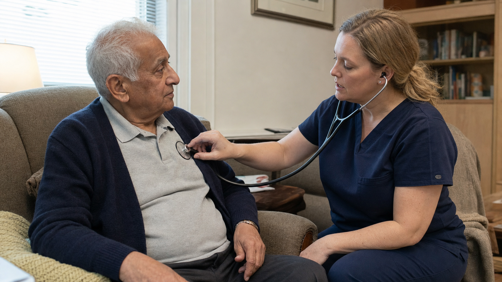 A registered nurse uses a stethoscope during an older man's assessment at home